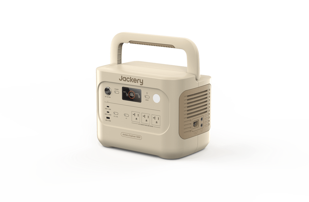 Jackery Explorer 1000v2 portable power station in Dune White with 1070Wh capacity, showing multiple charging ports and digital display.