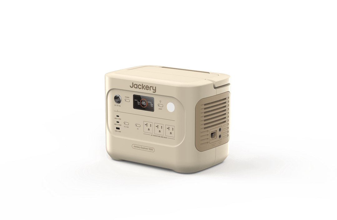Jackery Explorer 1000v2 portable power station in Dune White with 1070Wh capacity, showing multiple charging ports and digital display.