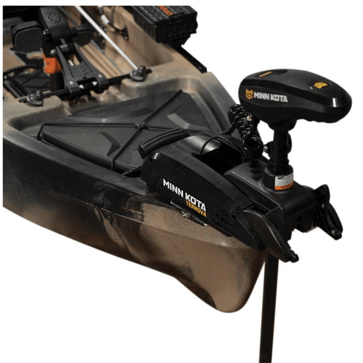 Meyer Old Town Sportsman PDL 120 Pro sit-on-top fishing kayak in tan, 12-foot pedal kayak with paddle and fishing gear.