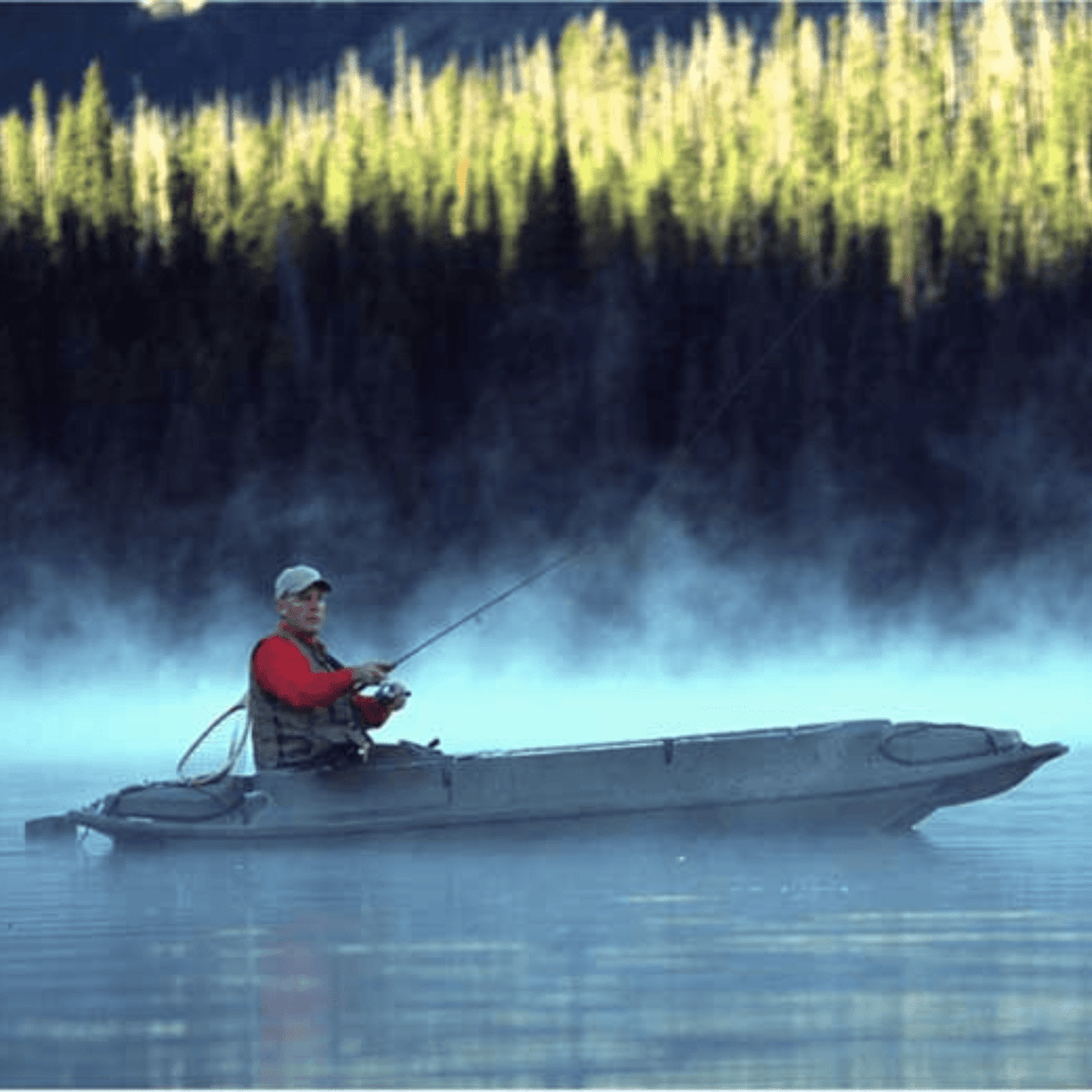 Meyer Beavertail Stealth 1200 sit-inside kayak in marsh brown with catamaran-style hull, shown on calm water.