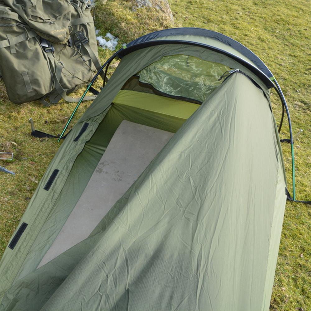 Chattanooga Snugpak Stratosphere Bivvi Shelter in olive, waterproof and breathable backpacking tent for one person, shown set up outdoors.