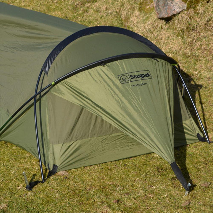 Chattanooga Snugpak Stratosphere Bivvi Shelter in olive, waterproof and breathable backpacking tent for one person, shown set up outdoors.