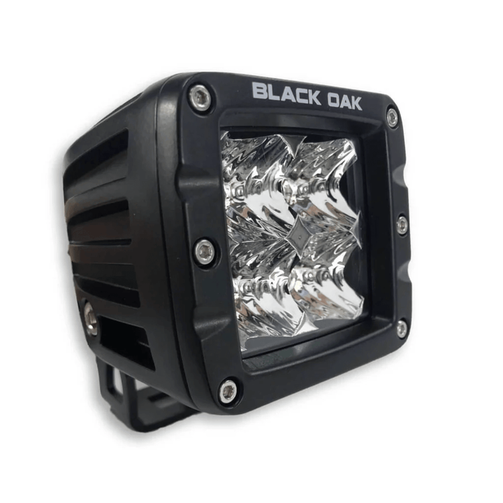 Black Oak LED 2-inch Amber Pod light with 3W Osram flood optics and black housing, designed for outdoor or automotive lighting.