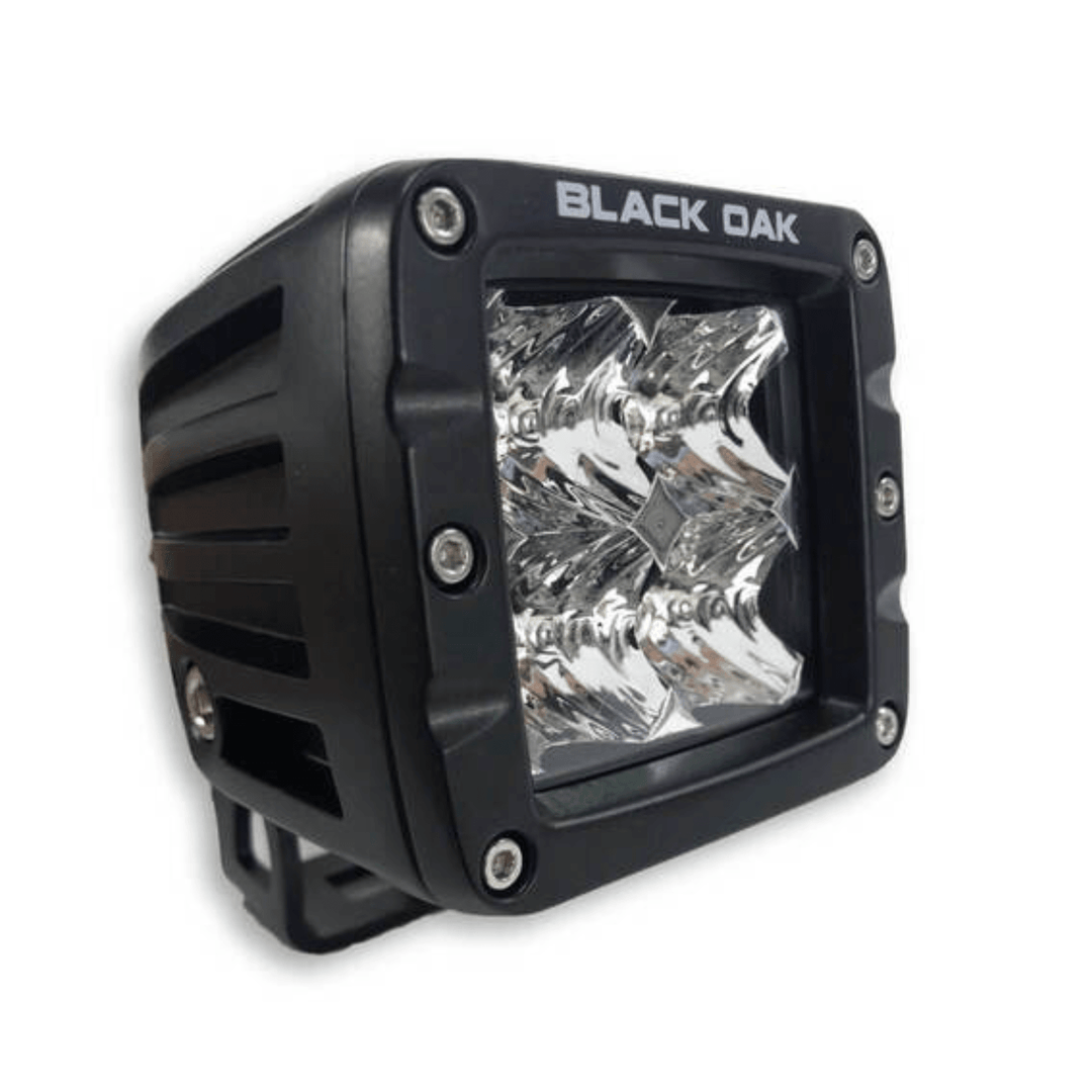 Black Oak LED 2-inch marine pod light with black housing, spot optics, 10-watt Cree LED for outdoor marine lighting.