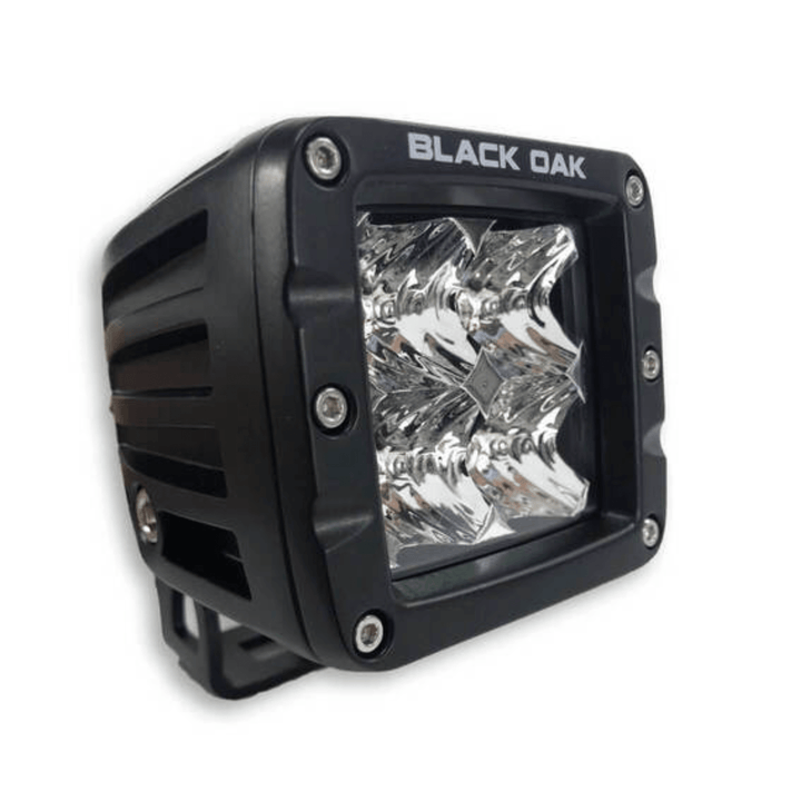 Black Oak LED 2-inch marine pod light with black housing, spot optics, 10-watt Cree LED for outdoor marine lighting.
