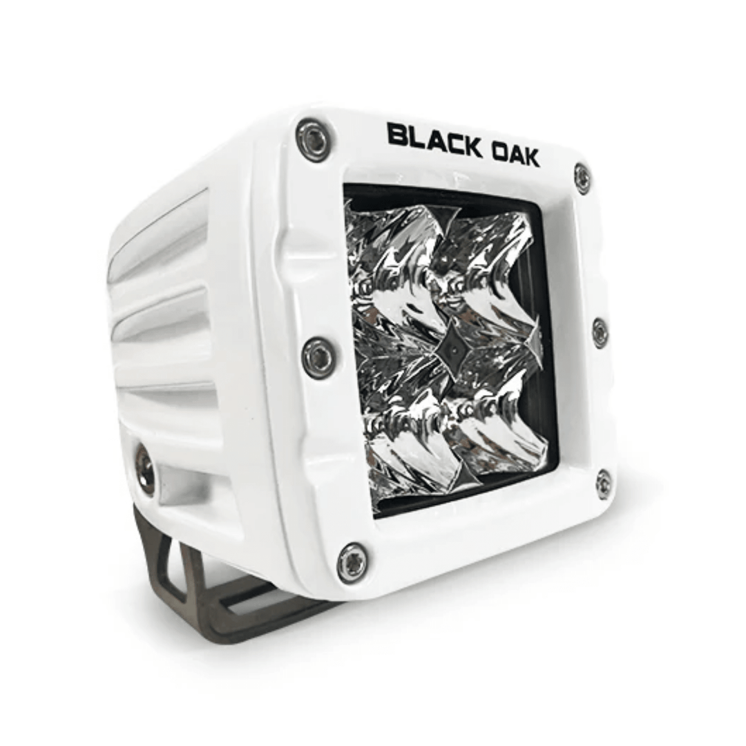 Black Oak LED 2-inch marine pod light with white housing, 10W Cree LED, spot optics, designed for boat lighting.