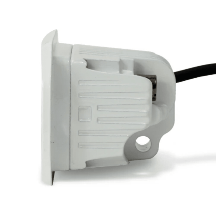 Black Oak LED 2-inch marine flush mount spreader light with white housing, ideal for boat lighting and waterproof applications.