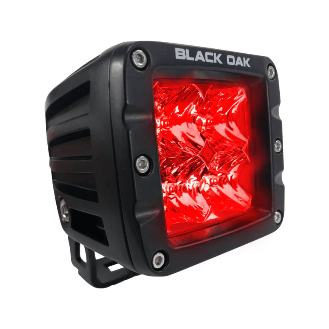 Black Oak LED 2-inch red predator pod light with flood optics, black finish, designed for LED lighting applications.
