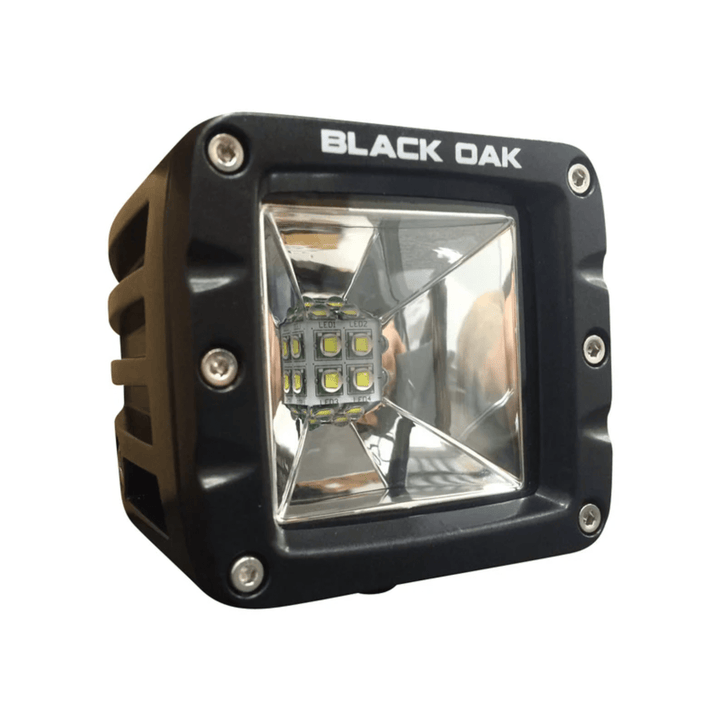 Black Oak LED 2-inch Scene Optics Pod with 10W Cree bulb and black housing, designed for high-quality LED lighting.