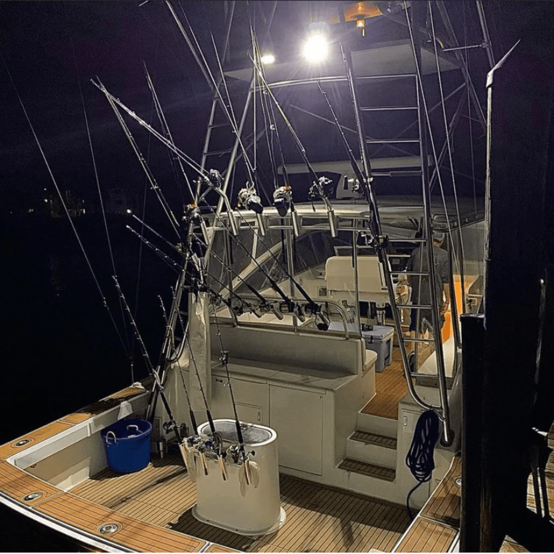 Black Oak LED 4-inch marine spreader light with white housing, scene optics, and flood beam for boat lighting.