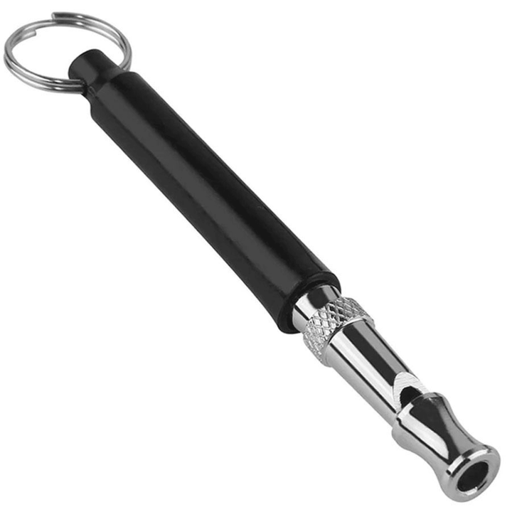 Black Chattanooga Omnipet European Silent Dog Training Whistle lying on a white background.