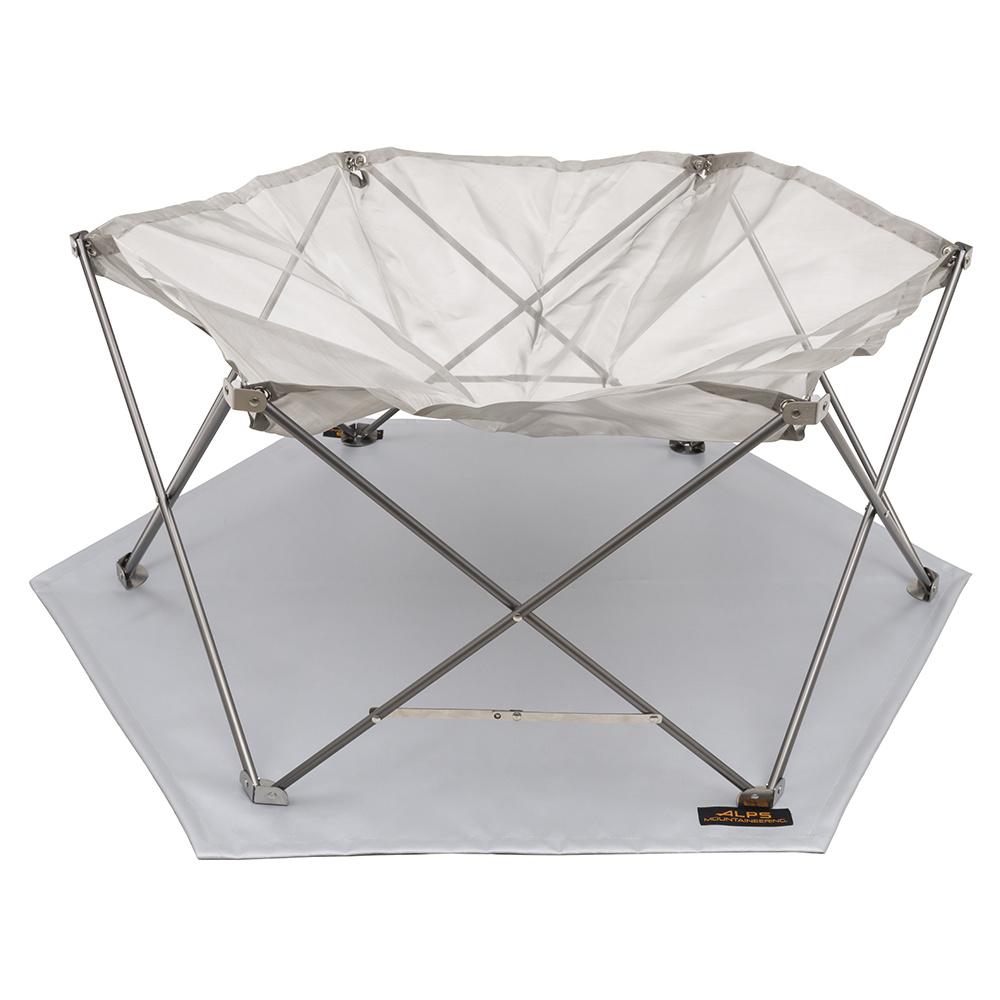 Chattanooga Alps Mountaineering Gaze Pit portable firepit with lightweight stainless steel mesh design for outdoor heating and ambiance.