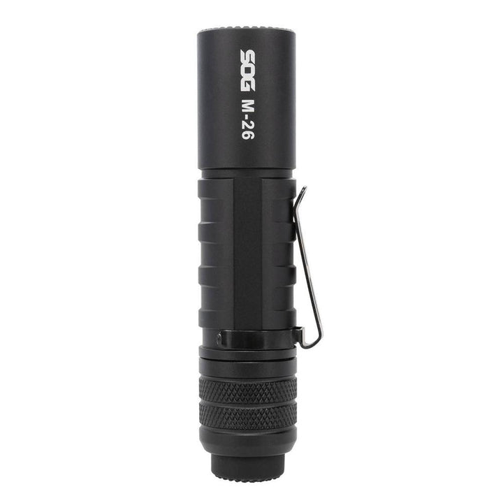 Black SOG Knives M26 flashlight with 1300 lumens, rechargeable outdoor light, handheld, durable design for outdoor use.