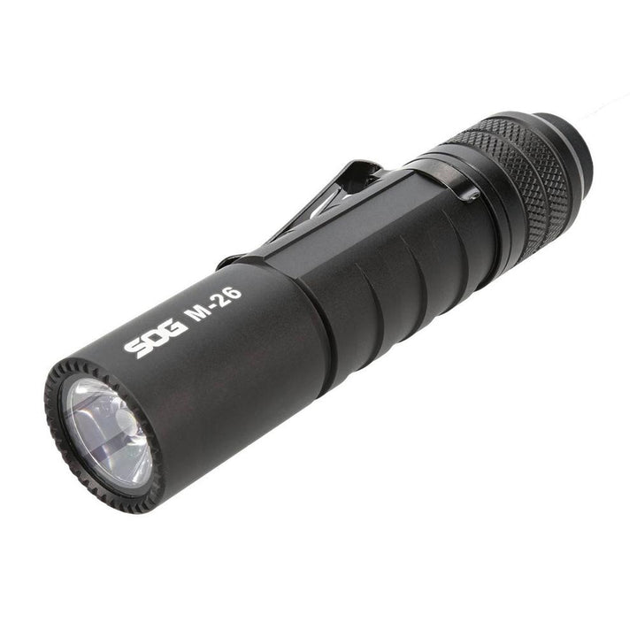 Black SOG Knives M26 flashlight with 1300 lumens, rechargeable outdoor light, compact and durable for outdoor use.