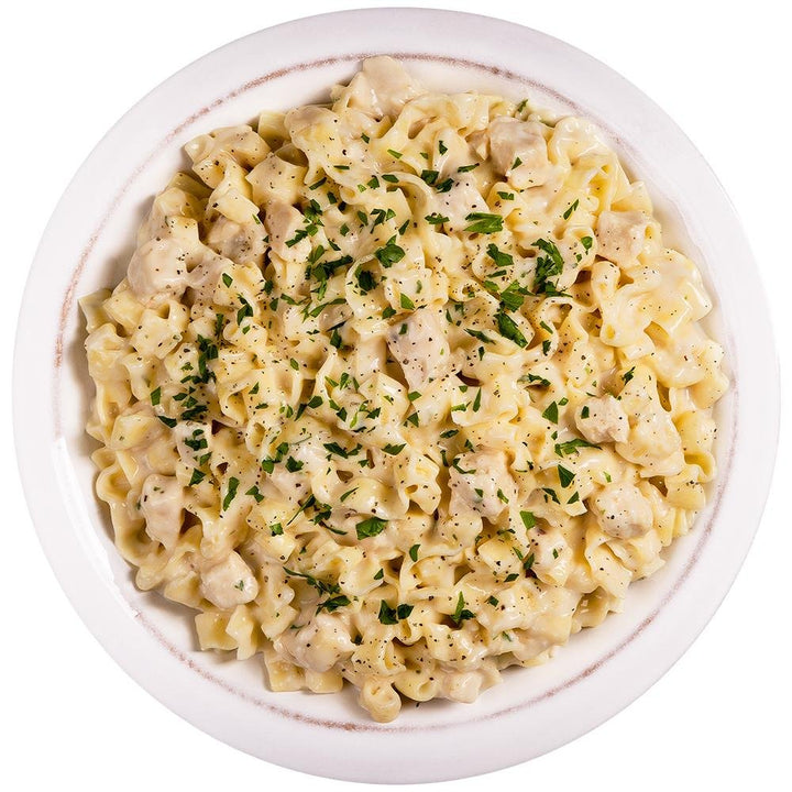 Chattanooga ReadyWise CP Pasta Alfredo with Chicken in a single-serving food container, creamy Alfredo sauce with chicken pieces.
