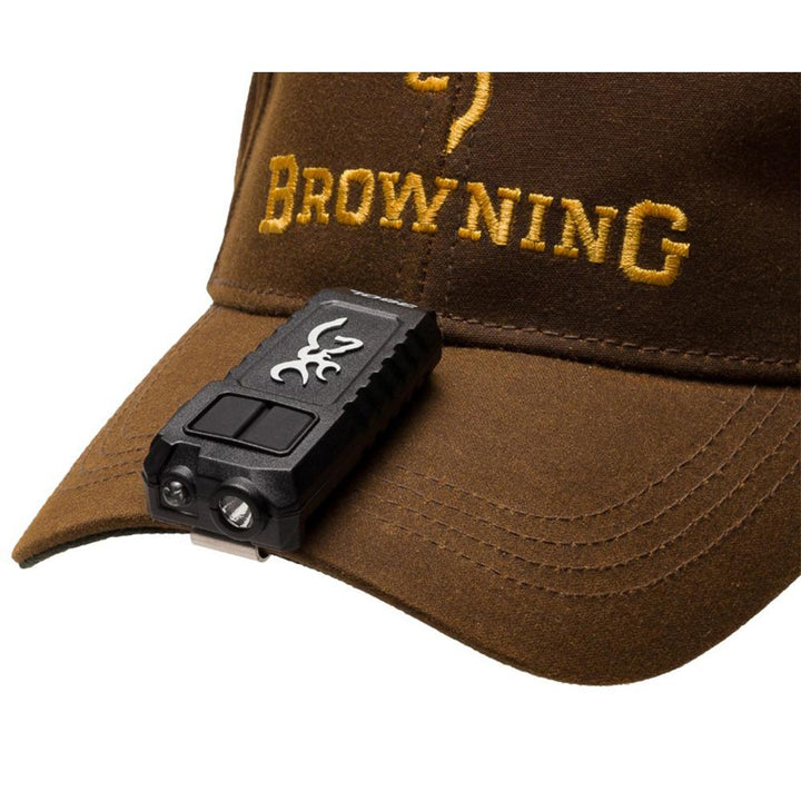 Black Browning Trailmate rechargeable USB cap flashlight headlamp with adjustable strap and bright LED light for outdoor use.