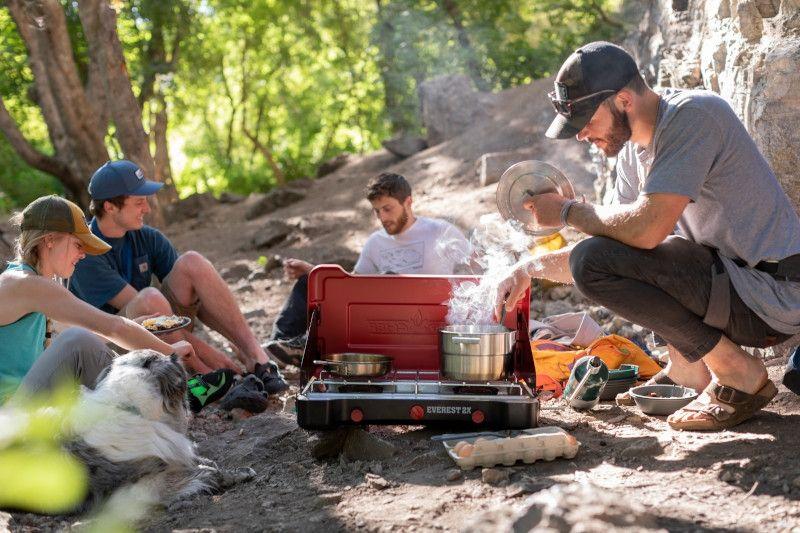 Chattanooga Camp Chef Mountain Series Everest 2X high output two-burner stove with black metal surface and control knobs.