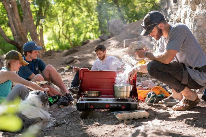 Chattanooga Camp Chef Mountain Series Everest 2X high output two-burner stove with black metal surface and control knobs.