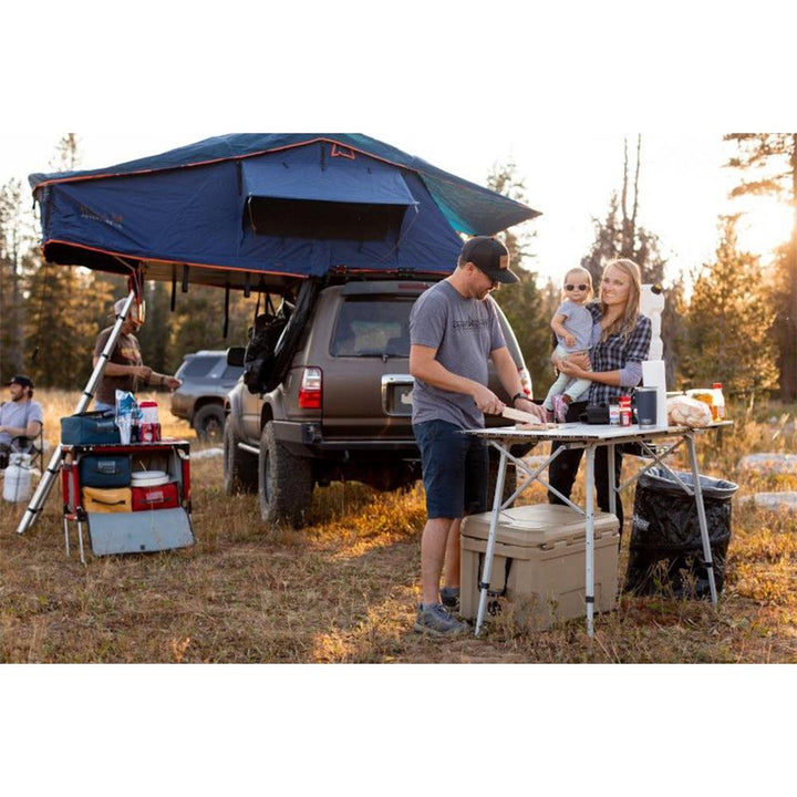 Chattanooga Camp Chef Mountain Series Mesa adjustable outdoor camp table with sturdy surface and foldable legs for camping.