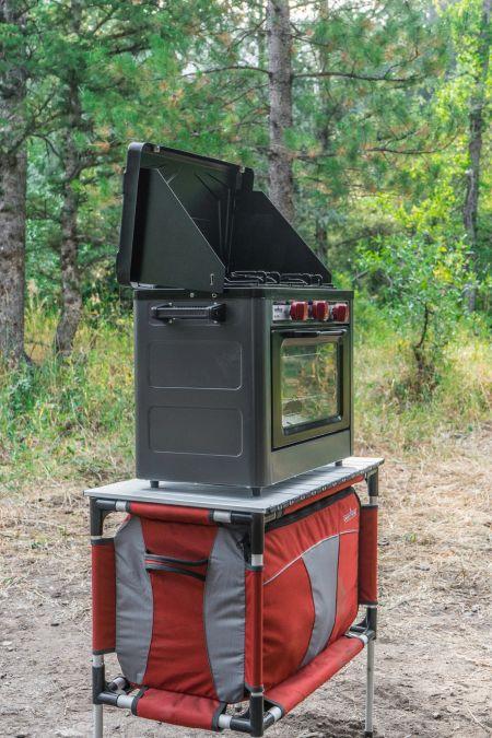Chattanooga Sherpa Table Organizer for Camp Chef Mountain Series, portable outdoor storage table with multiple compartments.