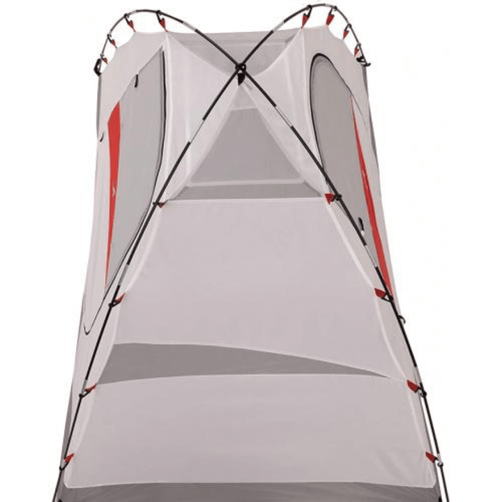 Chattanooga Alps Mountaineering Taurus 2-person polyester camping tent with fiberglass poles, set up outdoors in a forest setting.