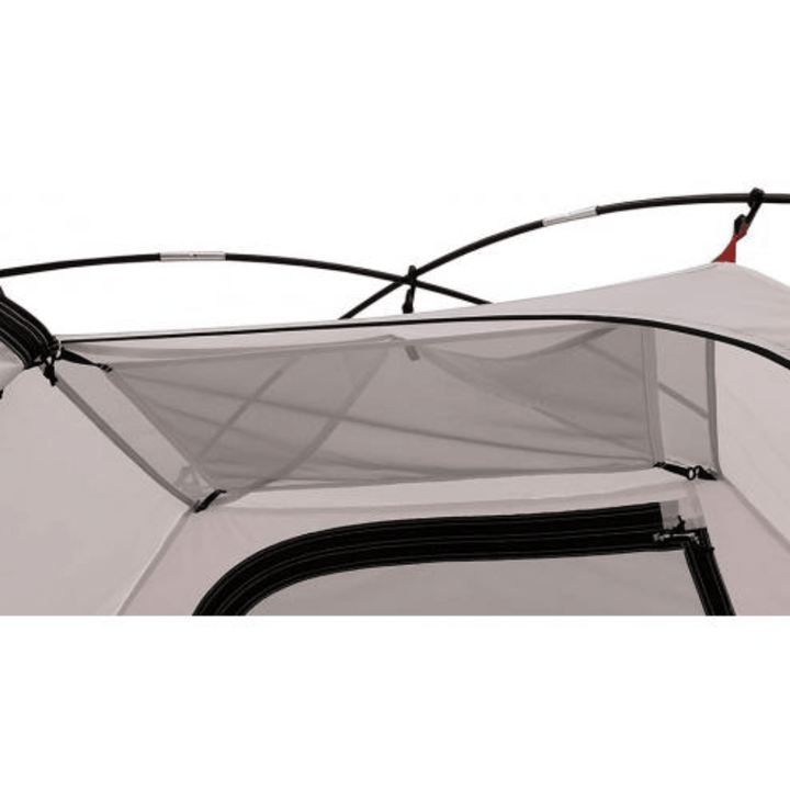 Chattanooga Alps Mountaineering Taurus 4-person polyester and fiberglass camping tent set up outdoors with open door and rainfly.