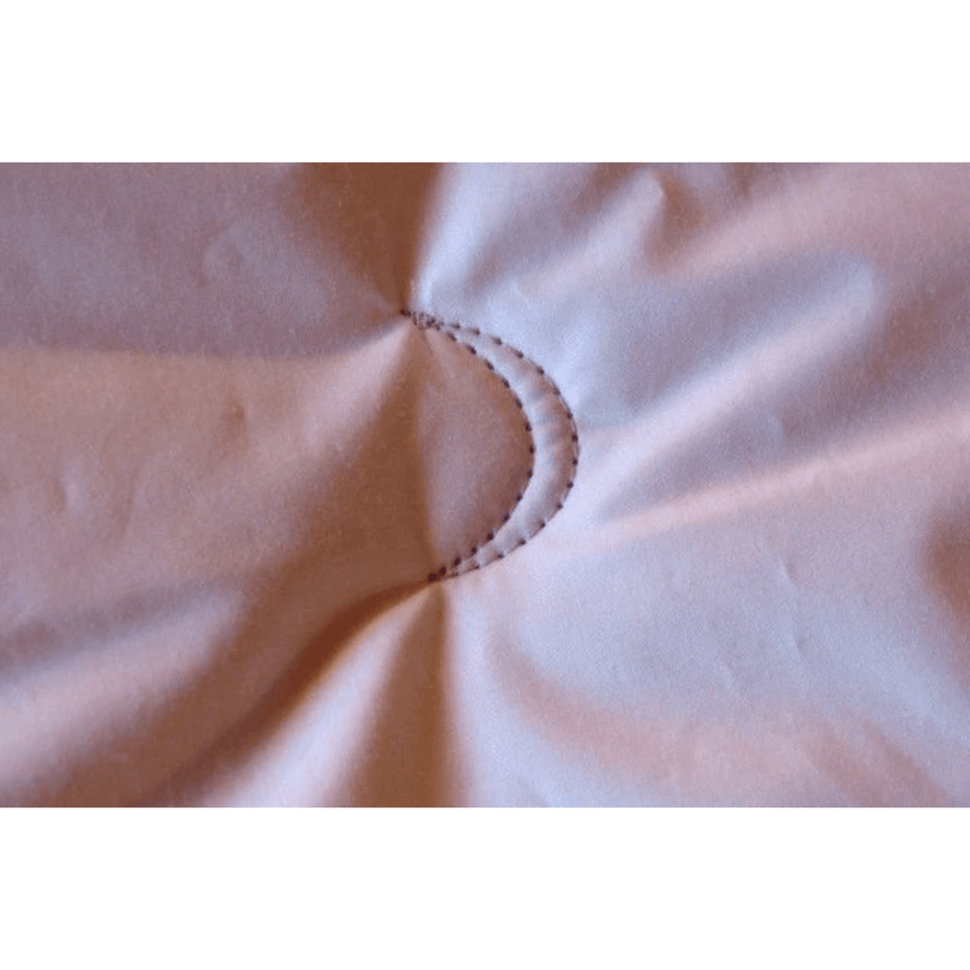 Crescent Moon organic alpaca and wool comforter on a bed, twin size 68" x 86", showcasing soft, natural summer bedding with cotton accents.