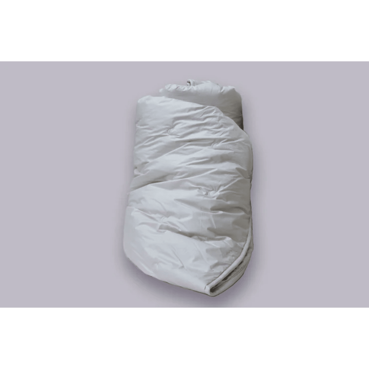 Crescent Moon organic alpaca wool comforter on a bed, twin size, showcasing soft, cozy cotton bedding for summer.