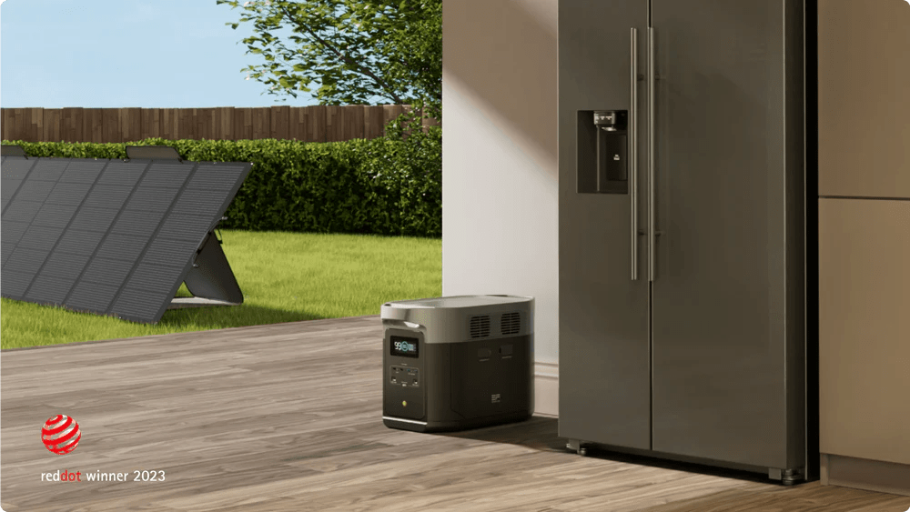 EcoFlow DELTA 2 Max portable power station with a 160W solar panel, showing the compact device and solar panel outdoors.