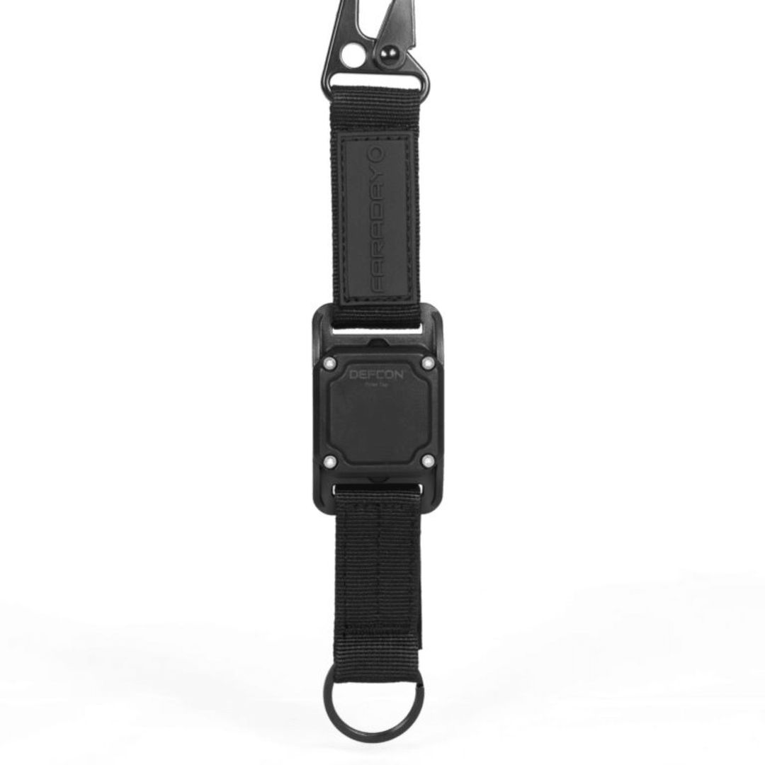 Faraday DEFCON Pulse Tag personal wearable EMP detection system with digital display and clip for portable EMP threat monitoring.