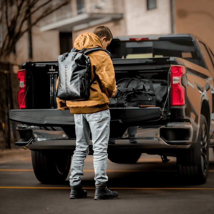 Faraday waterproof dry bag backpack with 3-piece NX3 kit for travel, offering shielding and secure storage for electronic devices.
