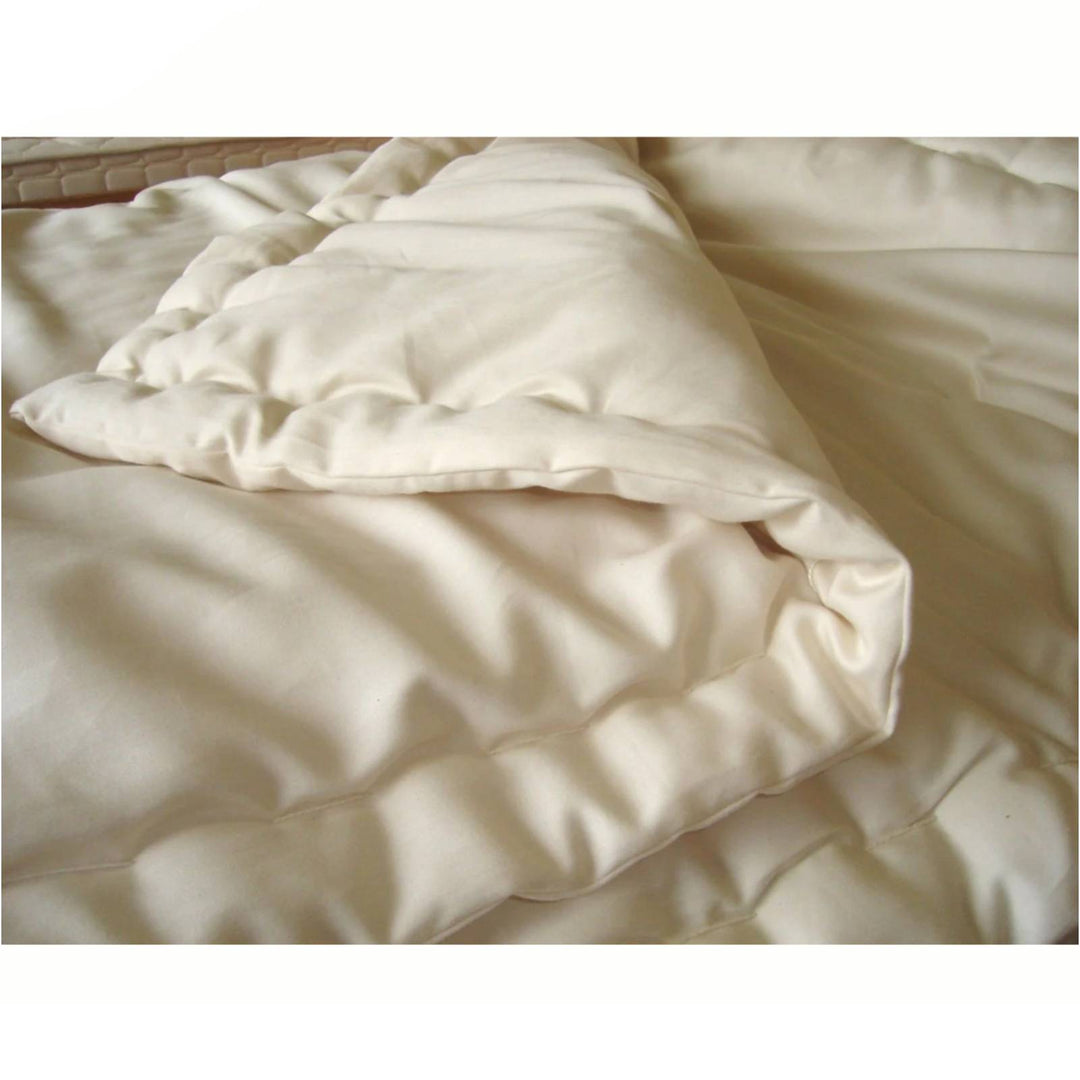 Holy Lamb Organic Wool Comforter in twin size, light weight with a soft, natural wool filling and clean white fabric cover.