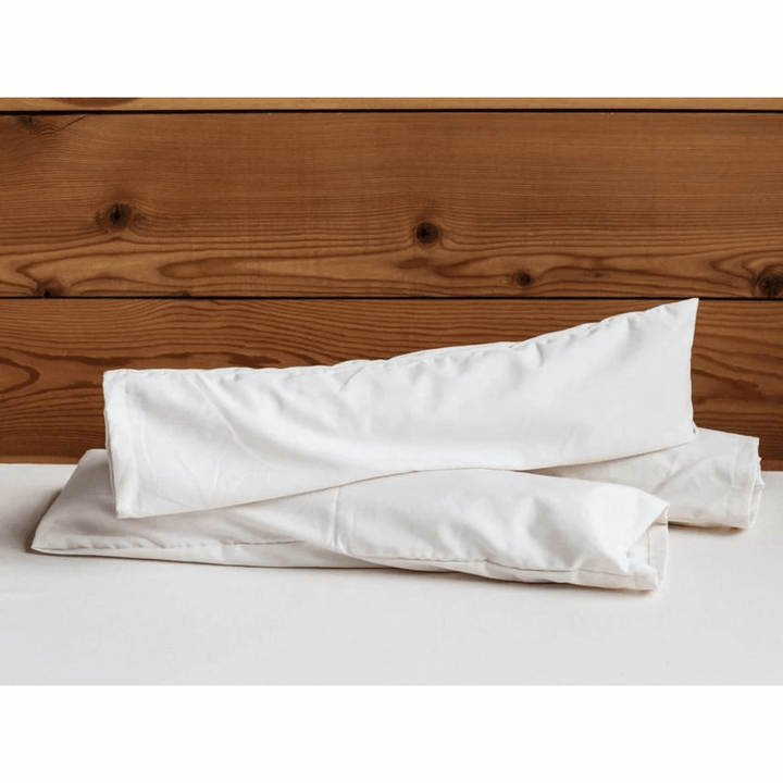Holy Lamb Organics neck roll support cushion for sleep and relaxation, soft fabric with a cylindrical shape and plush filling.