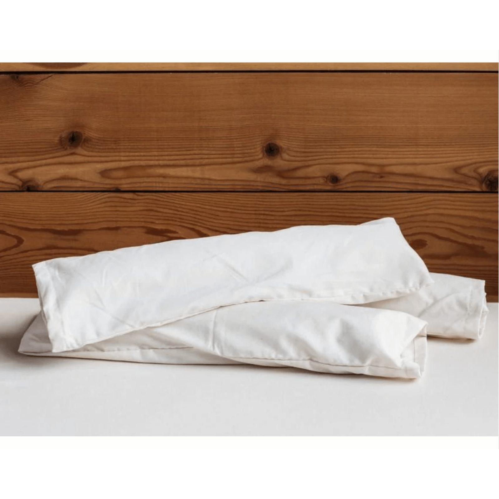 Holy Lamb Organics neck roll cushion for sleep and relaxation, supportive neck pillow with soft fabric and ergonomic design.