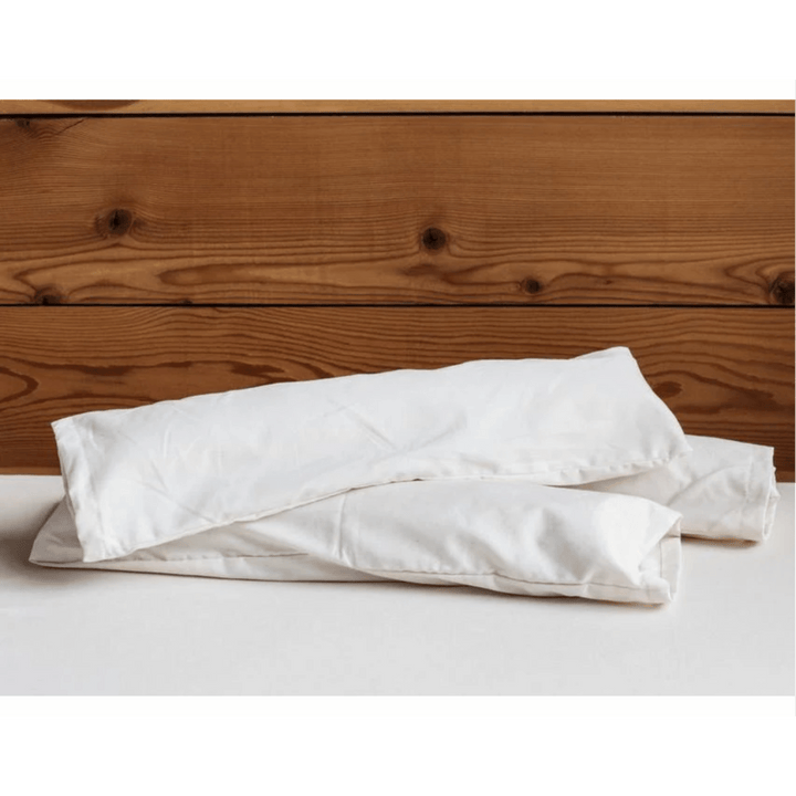 Holy Lamb Organics neck roll cushion for sleep and relaxation, supportive neck pillow with soft fabric and ergonomic design.