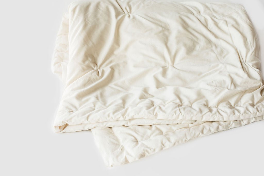 Holy Lamb Wool Comforter in queen size, light and cool, showcasing soft, cozy wool filling and a clean, inviting bedding design.