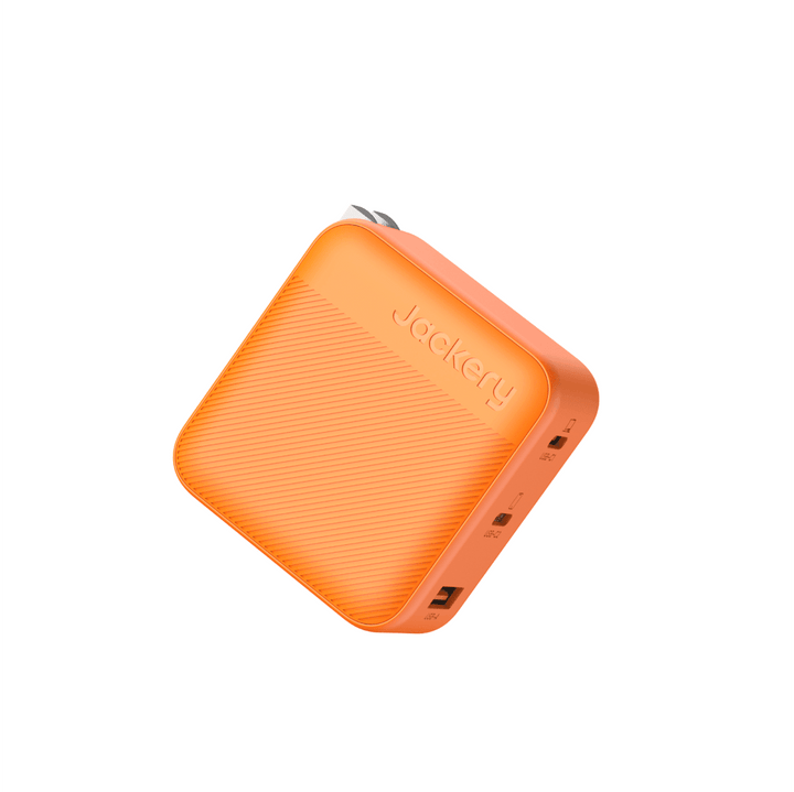 Jackery 102W GaN 3-port fast charger with compact design and multiple USB charging ports.