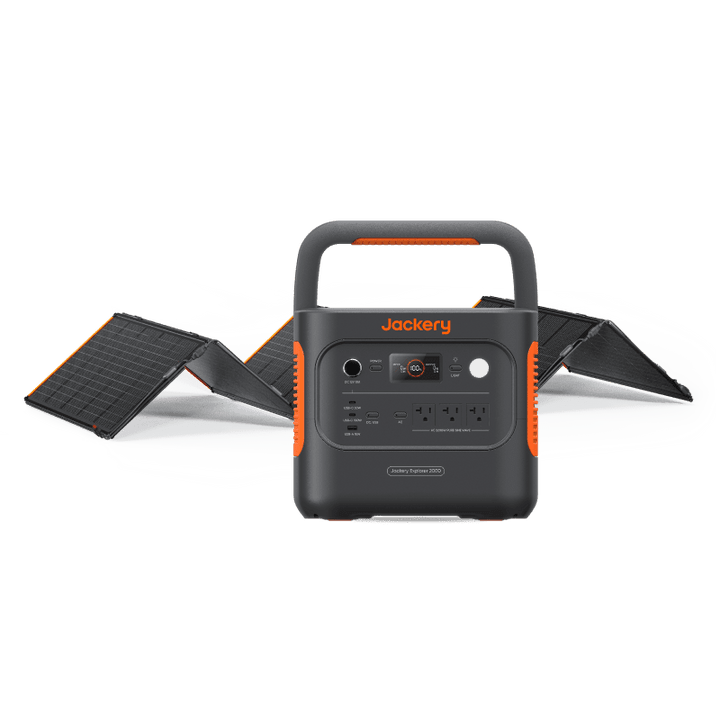 Jackery Explorer 2000 V2 portable power station with 2042Wh capacity and two SolarSaga 200W solar panels outdoors.