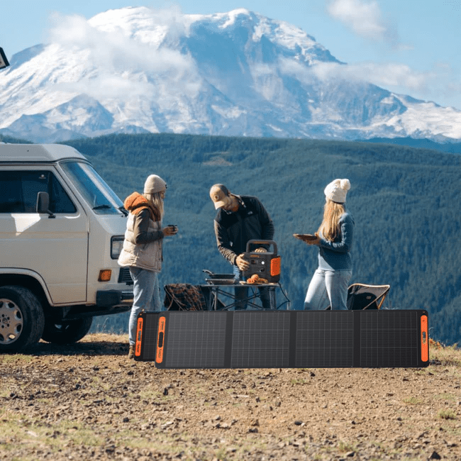 Jackery Explorer 2000 V2 portable power station with 2042Wh capacity and two SolarSaga 200W solar panels in a home setup.