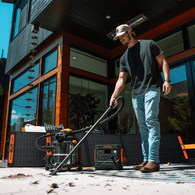 Jackery Explorer 2000 V2 portable power station with 2042Wh capacity and two SolarSaga 200W solar panels for renewable energy.