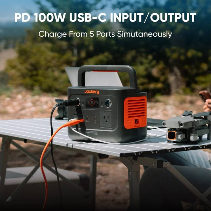 Jackery Explorer 240 v2 portable power station with handle and digital display for charging devices on the go.