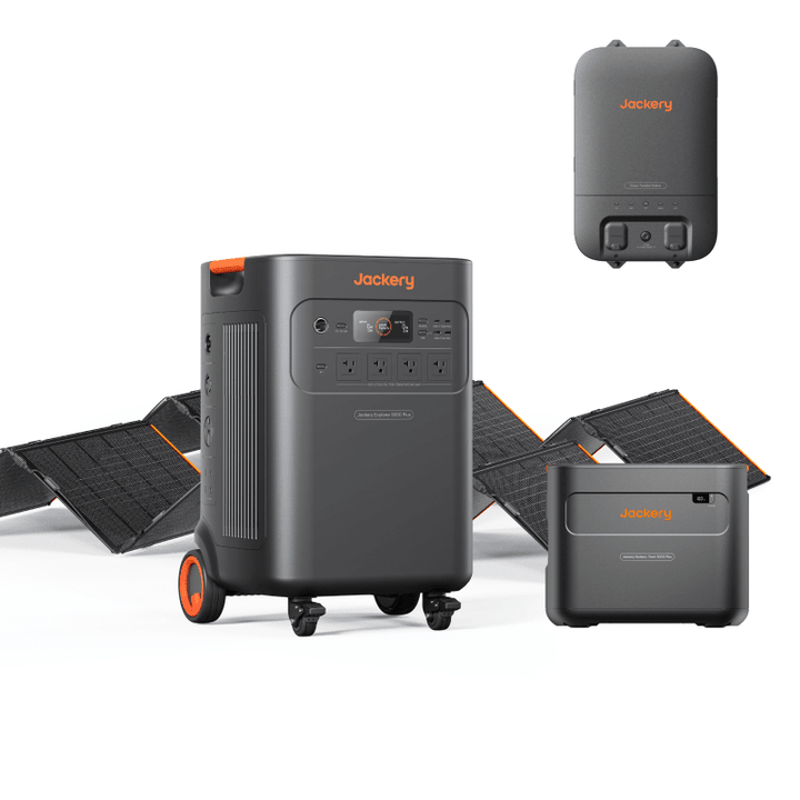Jackery Explorer 5000 Plus portable power station with battery pack, two SolarSaga 500 X panels, and transfer switch.