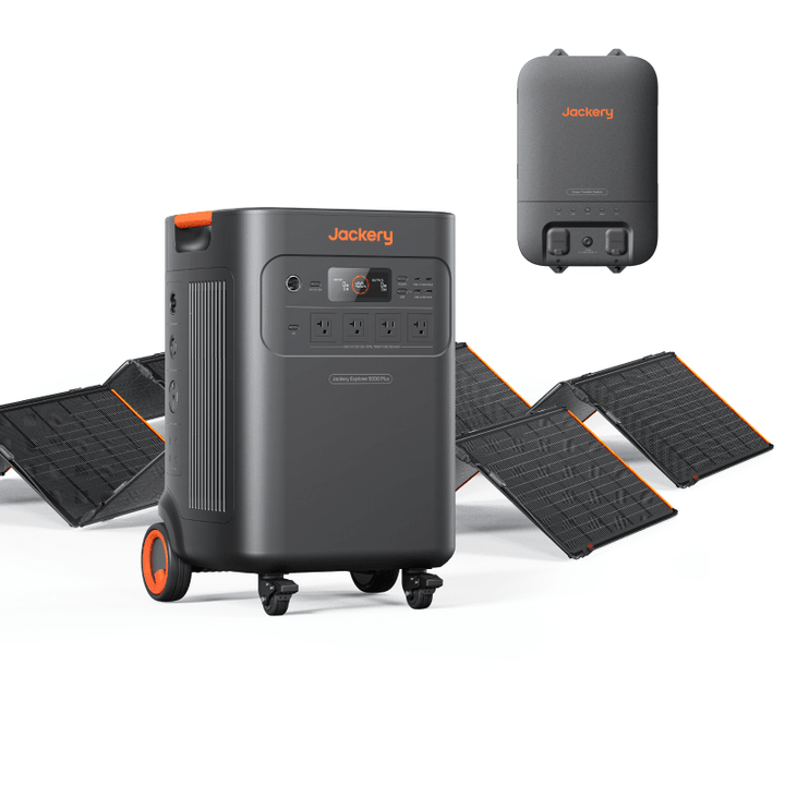 Jackery Explorer 5000 Plus portable solar generator with two SolarSaga 500 X panels and transfer switch for outdoor power.