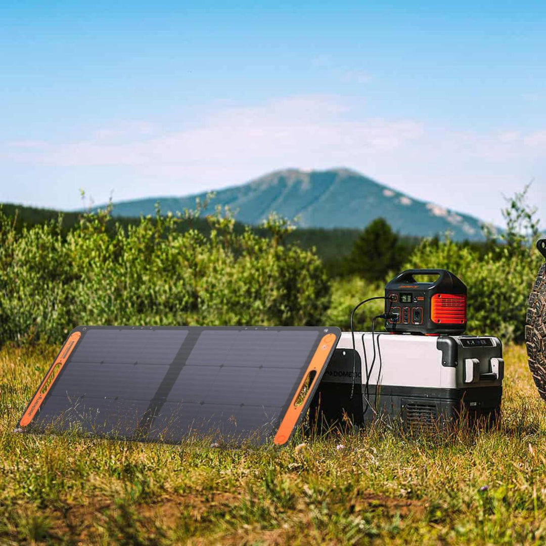 Jackery Solar Generator 500 portable power station with SolarSaga 80W solar panel shown outdoors in use