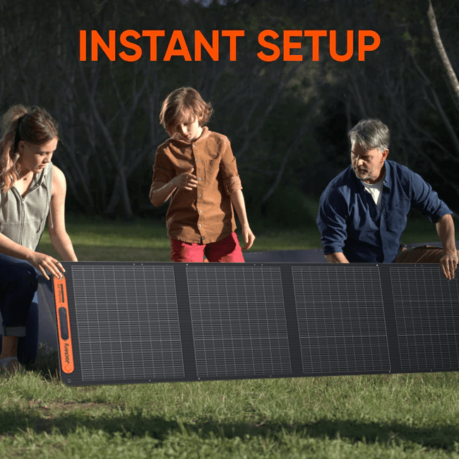 Jackery SolarSaga 200W portable solar panel outdoors, showing black photovoltaic cells and sturdy frame in bright sunlight.