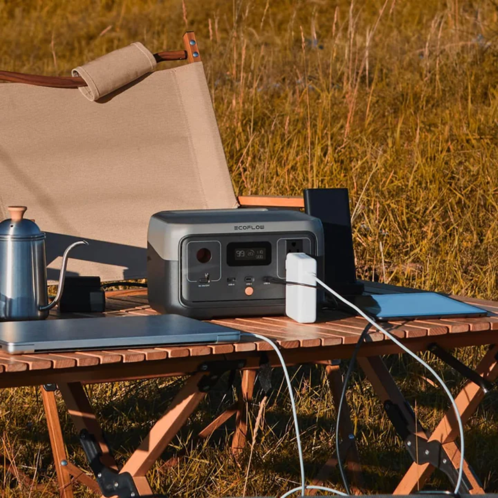EcoFlow RIVER 2 Portable Power Station Lightweight Reliable Fast Charging Energy on camping table outdoors.