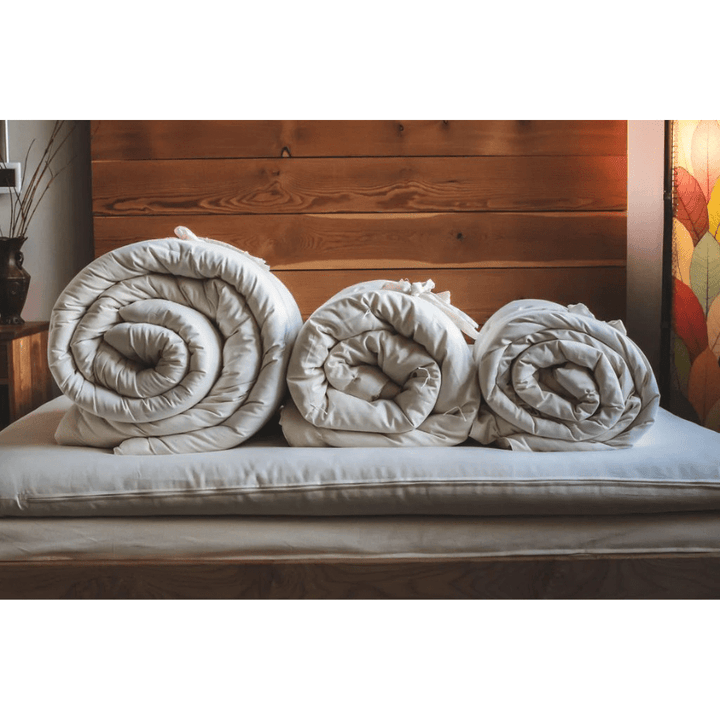 Holy Lamb Organic Wool Comforter in king size, showcasing its plush, extra-warm organic wool filling and soft fabric exterior.